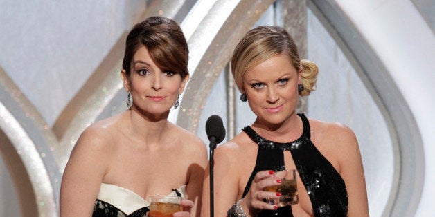 BEVERLY HILLS, CA - JANUARY 13: In this handout photo provided by NBCUniversal, L to R Tina Fey and Amy Poehler host the 70th Annual Golden Globe Awards at the Beverly Hilton Hotel International Ballroom on January 13, 2013 in Beverly Hills, California. (Photo by Paul Drinkwater/NBCUniversal via Getty Images)