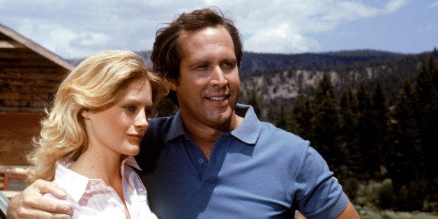 UNSPECIFIED - JULY 24: Medium shot of Chevy Chase as Clark Griswold with arm around Beverly D'Angelo as Ellen Griswold. (Photo by Warner Bros./Getty Images)