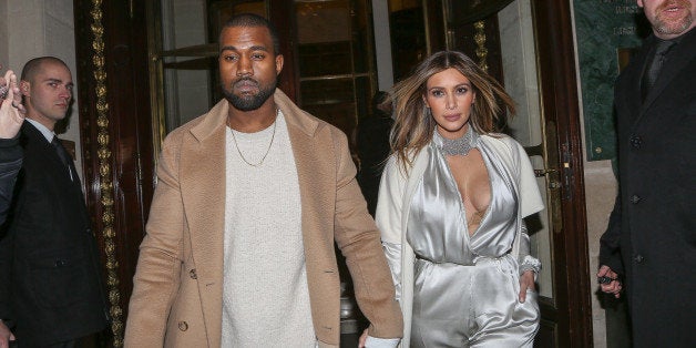 PARIS, FRANCE - JANUARY 21: Kanye West and Kim Kardashian leave the 'Meurice' hotel on January 21, 2014 in Paris, France. (
