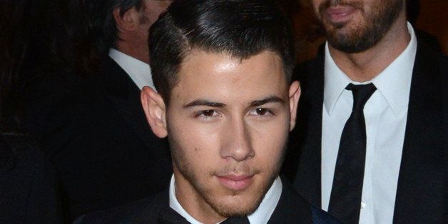 LOS ANGELES, CA - JANUARY 12: Nick Jonas leaves the Golden Globe After Party at The Beverly Hilton Hotel on January 12, 2014 in Los Angeles, California. (Photo by C Flanigan/Getty Images)