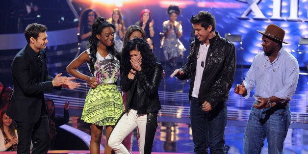 HOLLYWOOD, CA - FEBRUARY 20: Contestant Jena Irene (C) is seen with (L-R) host Ryan Seacrest and contestants Bria Anai, Spencer Lloyd, and C.J. Harris after hearing that she was voted into the top 13 on FOX's 'American Idol' Season 13 Top 20 to 13 Live Elimination Show on February 20, 2014 in Hollywood, California. (Photo by FOX via Getty Images)