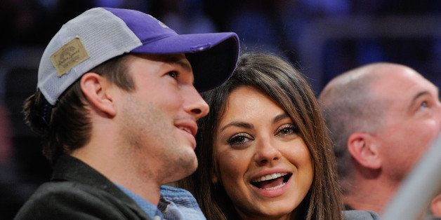 LOS ANGELES, CA - JANUARY 03: Ashton Kutcher (L) and Mila Kunis attend a basketball game between the Utah Jazz and the Los Angeles Lakers at Staples Center on January 3, 2014 in Los Angeles, California. (Photo by Noel Vasquez/Getty Images)