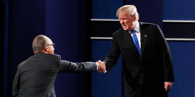 Republican U.S. presidential nominee Donald Trump greets moderator Lester Holt (L) prior to the first presidential debate at Hofstra University in Hempstead, New York, U.S., September 26, 2016. REUTERS/Lucas Jackson