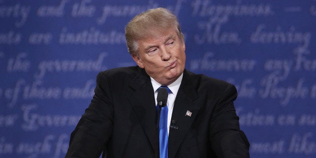 HEMPSTEAD, NY - SEPTEMBER 26: Republican presidential nominee Donald Trump gestures during the Presidential Debate at Hofstr
