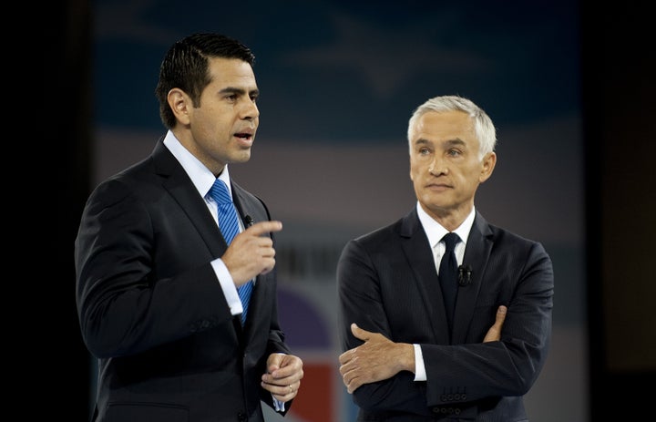 Noticiero Univision co-Anchor and 'Al Punto' host Jorge Ramos (R) and Univision President Cesar Conde (L) introduce US President Barack Obama to participate in a town hall meeting hosted by Univision at Bell Multicultural High School in Washington, DC, March 28, 2011. AFP PHOTO/Jim WATSON (Photo credit should read JIM WATSON/AFP/Getty Images)