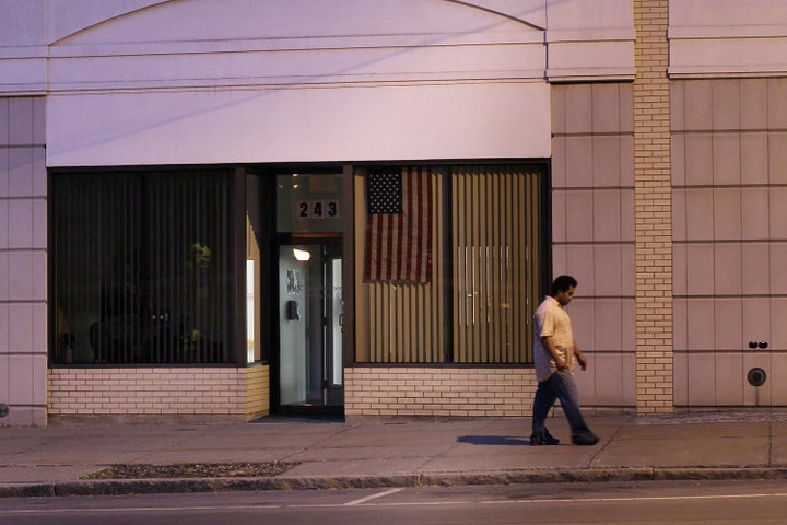UTICA, NY - MAY 14: A man walks down a street on May 14, 2012 in Utica, New York. Like many upstate New York communities, Uti
