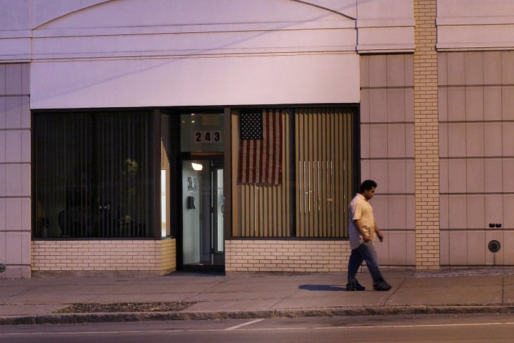 UTICA, NY - MAY 14: A man walks down a street on May 14, 2012 in Utica, New York. Like many upstate New York communities, Utica is struggling to make the transition from a former manufacturing hub. The city's individual poverty rate is twice the national average with an unemployment rate of 9.8% as of February 2012. Citing Utica's weakening financial margins over the past two years, Fitch Ratings downgraded its credit rating on Utica by two notches to a triple-B, two rungs above junk territory. (Photo by Spencer Platt/Getty Images)