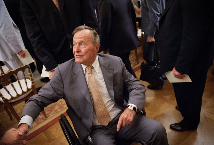 Former US President George H.W. Bush shakes hands as he departs from the East Room following the official portrait unveiling of his son former US President George W. Bush and wife Laura Bush May 31, 2012 at the White House in Washington, DC. AFP PHOTO / Mandel NGAN (Photo credit should read MANDEL NGAN/AFP/Getty Images)