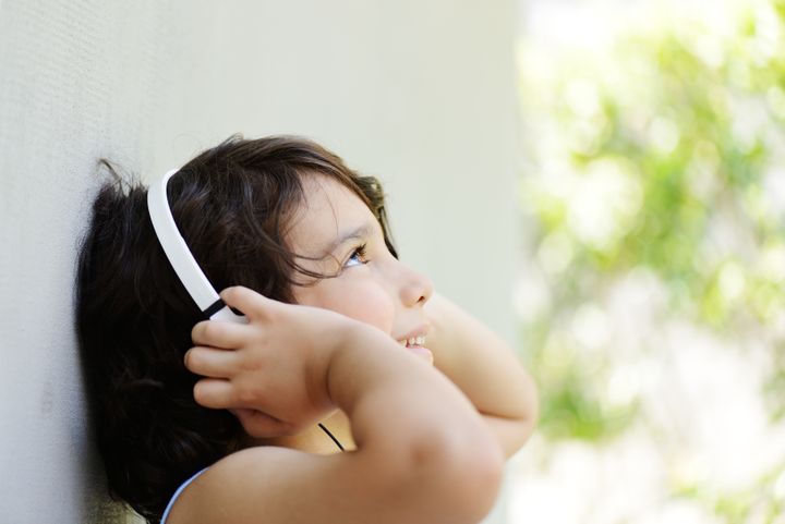 cute kid listening to music on...