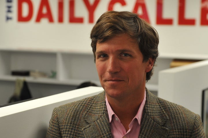 WASHINGTON, DC - JANUARY 7: Tucker Carlson, a conservative pundit, at the office of the new website, the Daily Caller, on Jan