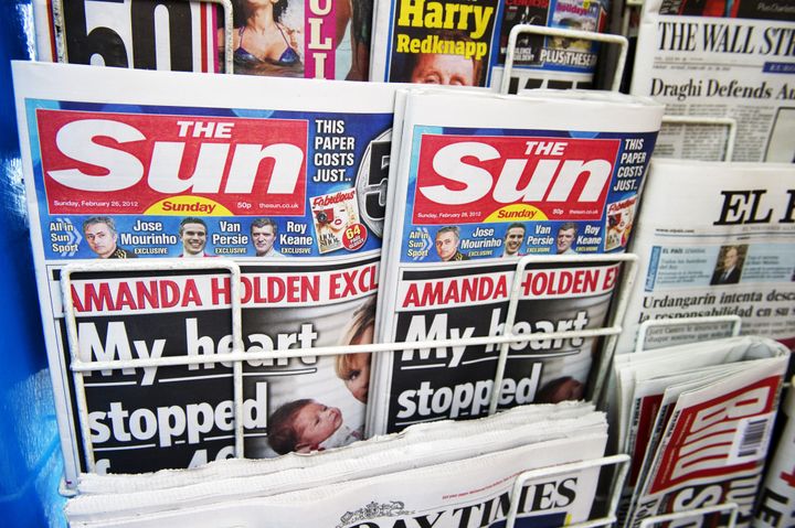 A picture taken on February 26, 2012 in London, shows front pages of today's edition of the new British Newspaper 'The Sun on Sunday.' Rupert Murdoch's Sun on Sunday tabloid rolled off the presses for the first time, with a pledge that the paper replacing the scandal-hit News of the World would abide by ethical standards. AFP PHOTO / MIGUEL MEDINA (Photo credit should read MIGUEL MEDINA/AFP/Getty Images)