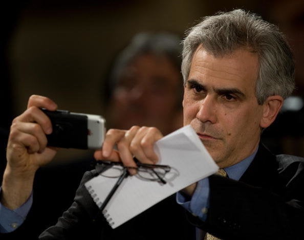 David Corn, a political journalist and author, Chief of the Washington bureau for Mother Jones, who also appears regularly on a variety of television political talk shows, takes a few photos before the start of US President Barack Obama's second press conference since coming into office, inside the East Room of the White House March 24, 2009 in Washington. AFP Photo/Paul J. Richards (Photo credit should read PAUL J. RICHARDS/AFP/Getty Images)