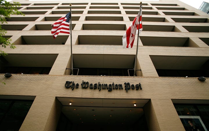 WASHINGTON - MAY 01: Flags wave in front of the Washington Post building on May 1, 2009 in Washington, DC. The newspaper has