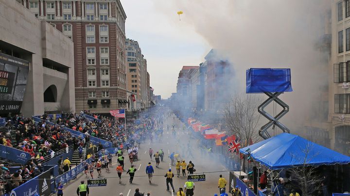 BOSTON - APRIL 15: Emergency personnel respond to the scene after two explosions went off near the finish line of the 117th Boston Marathon on April 15, 2013. (Photo by David L. Ryan/The Boston Globe via Getty Images)