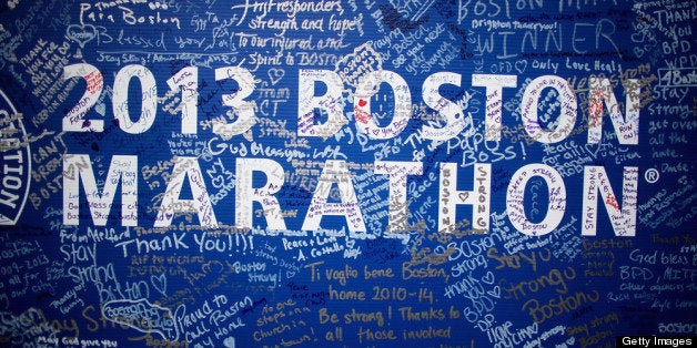BOSTON, MA - APRIL 23: Signatures adorn a Boston Marathon poster near the site of the Boston Marathon bombings on April 23,