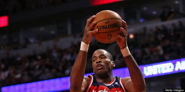 CHICAGO, IL - APRIL 17: Jason Collins #98 of the Washington Wizards rebounds against the Chicago Bulls at the United Center o