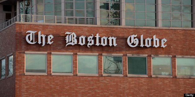 BOSTON, MA - FEBRUARY 20: The Boston Globe signage hangs on the side of its building on February 20, 2013 in Boston, Massachusetts. The New York Times Company, which owns The Boston Globe, said today its plans to sell the Globe and it's New England Media Group, and has hired an investment firm to help manage the sales process. (Photo by Darren McCollester/Getty Images)