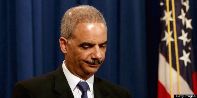 WASHINGTON, DC - MAY 14: U.S. Attorney General Eric Holder holds a Medicare fraud news conference at which he said he recused himself last year from a national security leak probe in which prosecutors obtained the phone records of Associated Press journalists at the Justice Department May 14, 2013 in Washington, DC. Holder faced a large number of questions about his department's investigation targeting phone records and data from the Associated Press. (Photo by Chip Somodevilla/Getty Images)