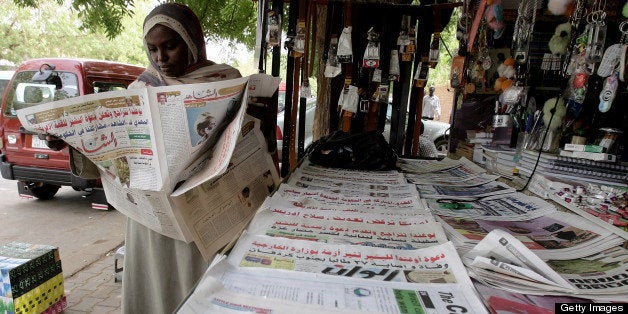 TO GO WITH STORY BY GUILLAUME LAVALEE A Sudanese woman reads a local newspaper in Khartoum on June 9, 2010. State censorship and repression is back in full force in the Sudanese press since the re-election of President Omar al-Beshir, according to complaints from independent and opposition papers. AFP PHOTO/ASHRAF SHAZLY (Photo credit should read ASHRAF SHAZLY/AFP/Getty Images)