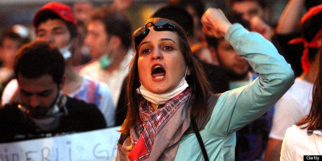 Protesters shout anti-government slogans during a demonstration in Ankara on June 4, 2013. Turkey's Islamic-rooted government apologised today to wounded protestors and said it had 'learnt its lesson' after days of mass street demonstrations that have posed the biggest challenge to Prime Minister Recep Tayyip Erdogan's decade in office. Turkish police had on June 1 begun pulling out of Istanbul's iconic Taksim Square, after a second day of violent clashes between protesters and police over a controversial development project. What started as an outcry against a local development project has snowballed into widespread anger against what critics say is the government's increasingly conservative and authoritarian agenda. AFP PHOTO/ADEM ALTAN (Photo credit should read ADEM ALTAN/AFP/Getty Images)