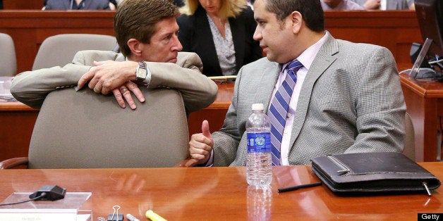 SANFORD, FL - JUNE 27: Defense attorney Mark O'Mara (L) talks with George Zimmerman during Zimmerman's murder trial in Seminole circuit court June 27, 2013 in Sanford, Florida. Zimmerman is charged with second-degree murder for the February 2012 shooting death of 17-year-old Trayvon Martin. (Photo by Jacob Langston-Pool/Getty Images)