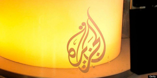 Al Jazeera network anchor Shihab Rattansi prepares to start the afternoon news program at the Al Jazeera English language cha