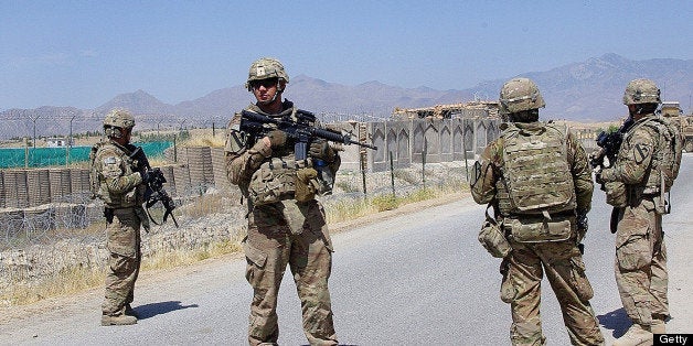 US soldiers, part of the NATO-led International Security Assistance Force (ISAF), stand guard on the outskirts of Laghman on June 5, 2013. The Afghan army and police have grown rapidly in a multi-billion international effort to build up the country's security forces, which now number roughly 350,000. AFP PHOTO/Waseem NIKZAD (Photo credit should read WASEEM NIKZAD/AFP/Getty Images)