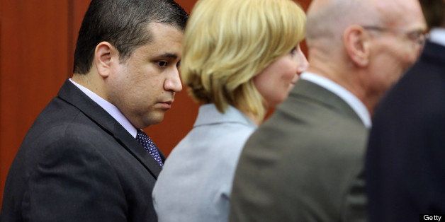 SANFORD, FL - JULY 13: (L-R) George Zimmerman looks down with his defense co-counsel, Lorna Truett, Don West and Mark O'Mara at the moment the verdict of not guilty is read, on the 25th day of his trial at the Seminole County Criminal Justice Center July 13, 2013 in Sanford, Florida. Zimmerman was charged with second-degree murder in the 2012 shooting death of Trayvon Martin. (Photo by Joe Burbank-Pool/Getty Images)