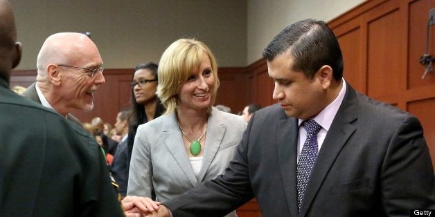 George Zimmerman is congratulated by his defense team after being found not guilty, on the 25th day of Zimmerman's trial at t
