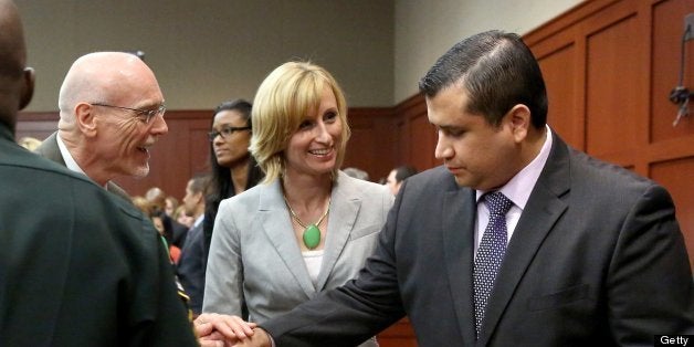 George Zimmerman is congratulated by his defense team after being found not guilty, on the 25th day of Zimmerman's trial at the Seminole County Criminal Justice Center, in Sanford, Forida, Saturday, July 13, 2013. Zimmerman had been charged with second-degree murder in the fatal shooting of Trayvon Martin, an unarmed teen, in 2012. (Pool photo/Joe Burbank/Orlando Sentinel/MCT via Getty Images