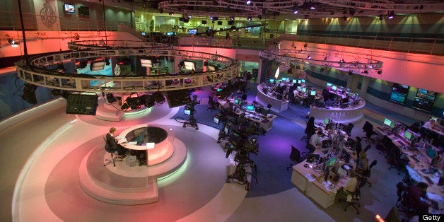 Lauren Taylor, presenting the news in the broadcast room of Al Jazeera English Language Channel, Doha, Qatar.