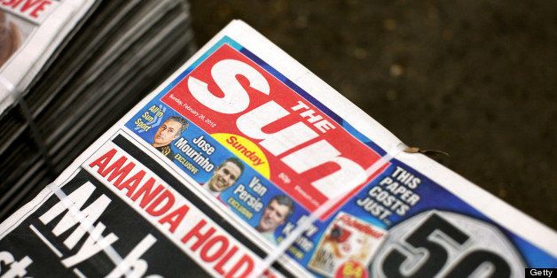 A stack of the first Sunday edition of the Sun newspaper, The Sun on Sunday, is displayed at a supermarket in Slough, U.K. on Sunday, Feb. 26, 2012. News Corp. returned to the Sunday tabloid market in the U.K. today as the company's 80-year-old Chief Executive Officer Rupert Murdoch counts on readers having moved on from the phone-hacking scandal that led to the closure of the News of the World seven months ago. Photographer: Simon Dawson/Bloomberg via Getty Images