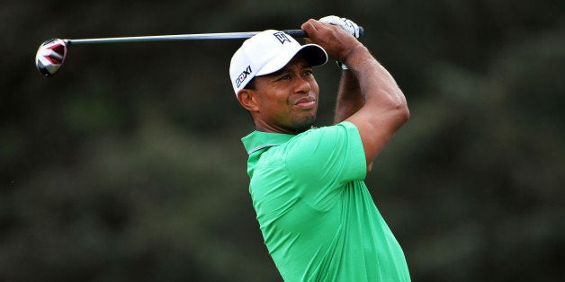 ROCHESTER, NY - AUGUST 09: Tiger Woods of the United States watches his tee shot on the seventh hole during the second round