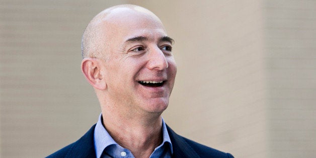 Jeff Bezos, founder and chief executive officer of Amazon Inc. and new owner of The Washington Post, leaves from the newspape