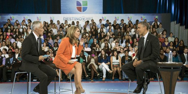 Hosts Jorge Ramos (L) and Maria Elena Salinas (C) sit with US President Barack Obama during a break in a taping of Univision News's 'Meet the Candidates' at the University of Miami September 20, 2012 in Coral Gables, Florida. Obama is traveling to Florida for the day to participate in a taping for Univision in Miami before attending a campaign event in Tampa. AFP PHOTO/Brendan SMIALOWSKI (Photo credit should read BRENDAN SMIALOWSKI/AFP/GettyImages)
