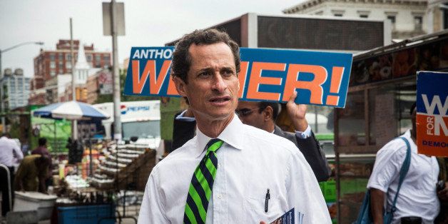 NEW YORK, NY - SEPTEMBER 10: New York City mayoral hopeful Anthony Weiner meets with people on a street corner In Harlem on September 10, 2013 in New York City. Registered voters in New York are voting today in the Democratic and Republican primary races to nominate party candidates for the New York mayoral race. (Photo by Andrew Burton/Getty Images)