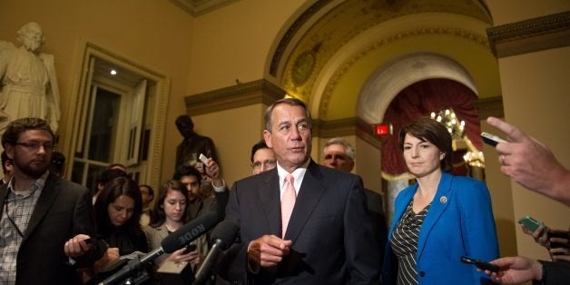 US House Speaker John Boehner takes a question as he speaks to the press at the US Capitol in Washington on October 1, 2013. The White House budget director late September 30, 2013 ordered federal agencies to begin closing down after Congress failed to pass a budget to avert a government shutdown. AFP PHOTO/Nicholas KAMM (Photo credit should read NICHOLAS KAMM/AFP/Getty Images)