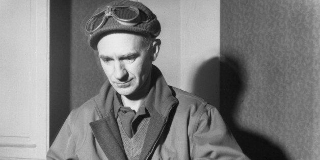 circa 1945: American journalist Ernie Pyle types at a desk in a jacket, a knit cap and goggles. (Photo by Hulton Archive/Getty Images)