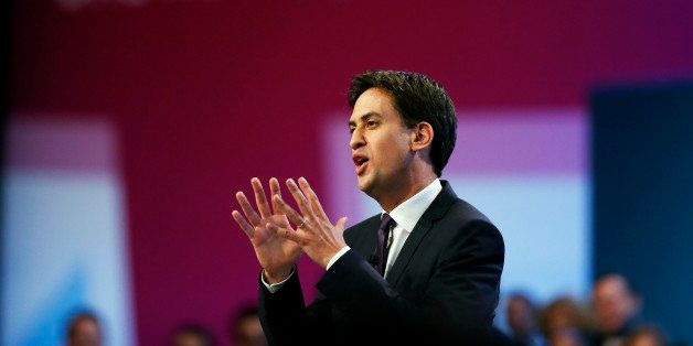 Britain's opposition Labour Party leader Ed Miliband gestures as he delivers his speech on the third day of the Labour party conference in Brighton, southern England, on September 24, 2013. AFP PHOTO / ADRIAN DENNIS (Photo credit should read ADRIAN DENNIS/AFP/Getty Images)