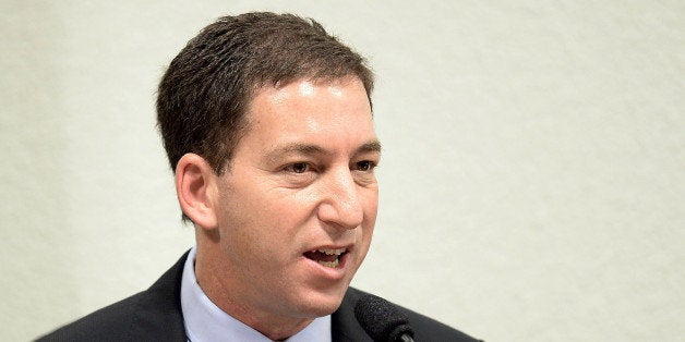 The Guardian's Brazil-based reporter Glenn Greenwald, who was among the first to reveal Washington's vast electronic surveillance program, testifies before the investigative committee of the Senate that examines charges of espionage by the United States in Brasilia on October 9, 2013, following press reports of US electronic surveillance in Brazil based on leaks from Edward Snowden, a former US National Security Agency contractor. AFP PHOTO/Evaristo Sa (Photo credit should read EVARISTO SA/AFP/Getty Images)