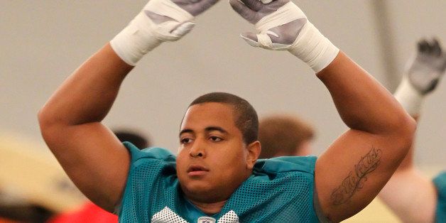 DAVIE, FL - MAY 4: Jonathan Martin #71 of the Miami Dolphins warms up prior to the rookie minicamp on May 4, 2012 at the Miami Dolphins training facility in Davie, Florida. (Photo by Joel Auerbach/Getty Images)