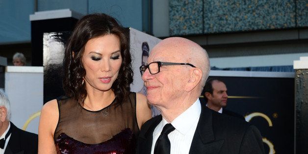Rupert Murdoch and wife Wendi Deng Murdoch arrives on the red carpet for the 85th Annual Academy Awards on February 24, 2013 in Hollywood, California. AFP PHOTO/FREDERIC J. BROWN (Photo credit should read FREDERIC J. BROWN/AFP/Getty Images)