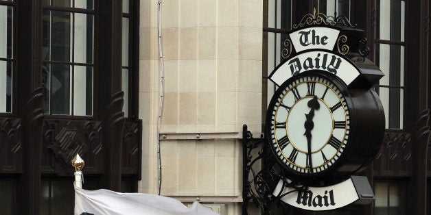 LONDON, ENGLAND - OCTOBER 04: A general view of a clock on the side of Northcliffe House, where the offices of British newspapers the Daily Mail and Mail On Sunday are located, on October 4, 2013 in London, England. The Daily Mail and sister paper The Mail On Sunday are under increasing pressure to apologise after a story published in last week's paper suggested that the leader of the Labour Party Ed Miliband's late father Ralph Miliband was anti-British. Two journalists from the Mail On Sunday were suspended after attending a private family memorial service held for Ed Miliband's uncle uninvited. (Photo by Dan Kitwood/Getty Images)