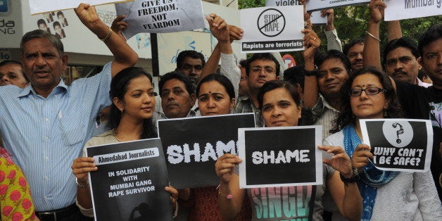 Indian journalists stage a protest against the gang-rape of a female colleague in Mumbai, at the Mahatma Gandhi Ashram in Ahmedabad on August 24, 2013. Mumbai police arrested a second man on accusations of gang-raping a female photographer in the Indian financial hub - an attack that has renewed anger over the country's treatment of women. AFP PHOTO/ Sam PANTHAKY (Photo credit should read SAM PANTHAKY/AFP/Getty Images)