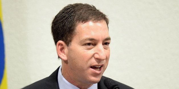 The Guardian's Brazil-based reporter Glenn Greenwald, who was among the first to reveal Washington's vast electronic surveillance program, testifies before the investigative committee of the Senate that examines charges of espionage by the United States in Brasilia on October 9, 2013, following press reports of US electronic surveillance in Brazil based on leaks from Edward Snowden, a former US National Security Agency contractor. AFP PHOTO/Evaristo Sa (Photo credit should read EVARISTO SA/AFP/Getty Images)