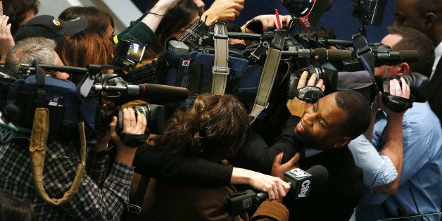 TORONTO, ON- NOVEMBER 13 - A reporter is caught in the crush of cameras while trying to get comment from Toronto Mayor Rob Ford at City Hall in Toronto. November 13, 2013. (Steve Russell/Toronto Star via Getty Images)