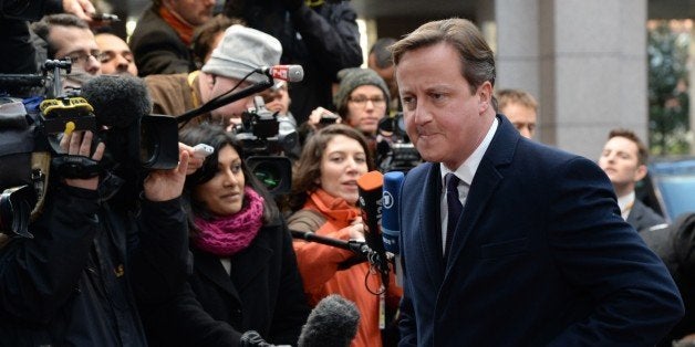 British Prime Minister David Cameron arrives to take part in an EU summit focused on the common security, Defence policy and
