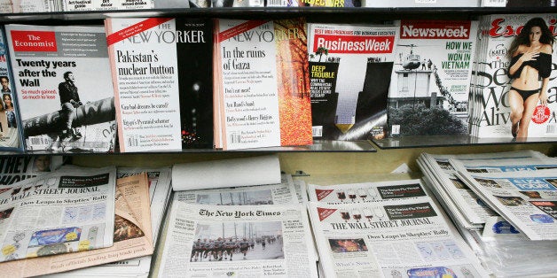 Copies of U.S. newspapers including the Wall Street Journal, New York Times, and USA Today sit on display at a news stand with magazines in New York, U.S., on Tuesday, Nov. 10, 2009. U.S. newspaper circulation declines steepened in the six months through September after publishers raised subscription and newsstand prices to help counter an advertising slump. Photographer: Gino Domenico/Bloomberg via Getty Images