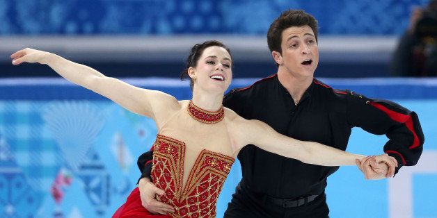 SOCHI, RUSSIA - FEBRUARY 09: Tessa Virtue and Scott Moir of Canada competes in the Team Ladies Free Skating during day two of the Sochi 2014 Winter Olympics at Iceberg Skating Palace onon February 9, 2014 in Sochi, Russia. (Photo by Matthew Stockman/Getty Images)