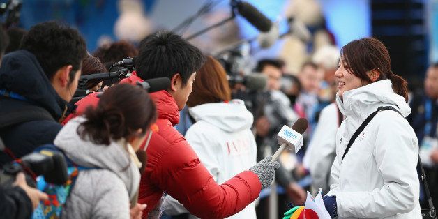 SOCHI, RUSSIA - FEBRUARY 02: Speed skater Ayaka Kikuchi (R) is interviewed by media reporters during a welcome ceremony prior to the Sochi 2014 Winter Olympics, at the Coastal Olympic Village on February 2, 2014 in Sochi, Russia. (Photo by Robert Cianflone/Getty Images)